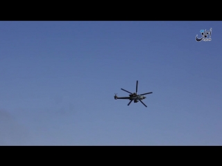 terrorists are trying to shoot down an attack helicopter mi-28 of the russian aerospace forces.